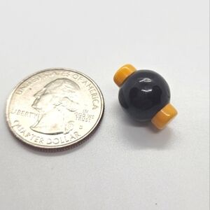 Rare bakelite two tone button. Black and yellow art deco vintage